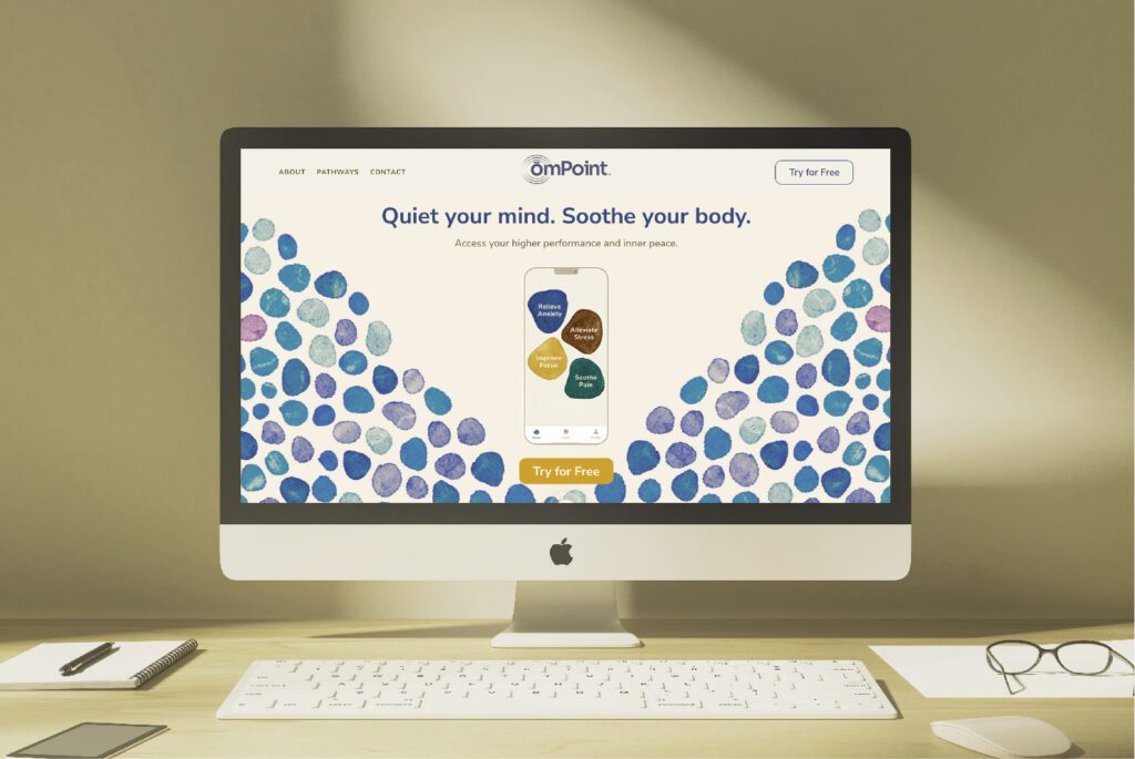 The content in omPoint's app and website of omPoint was guided by One Sacred Thread, as seen here on an iMac.